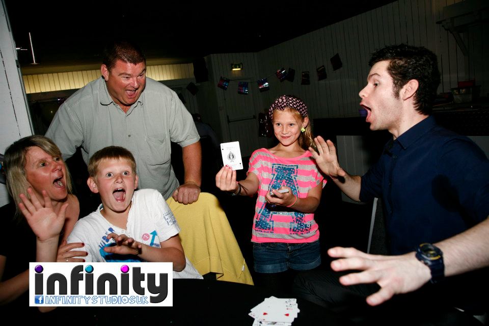 Magic with magician and a family of four. 